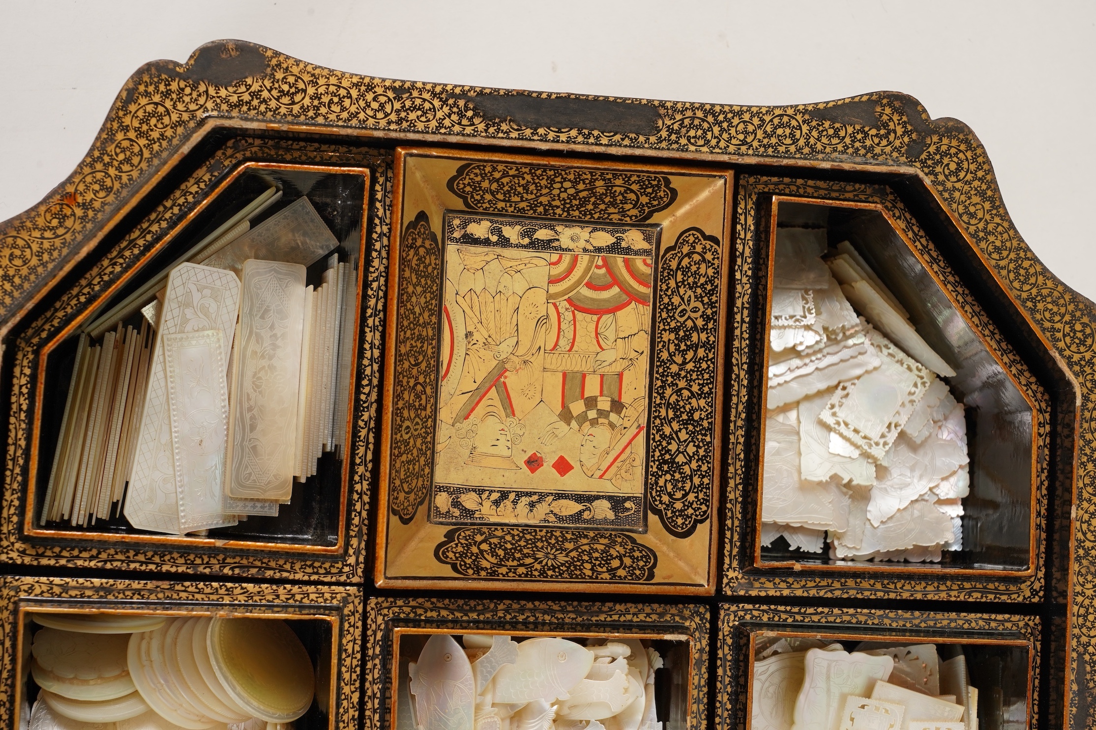 Two Chinese gilt decorated black lacquer games boxes, containing numerous mother-of-pearl counters, 19th century